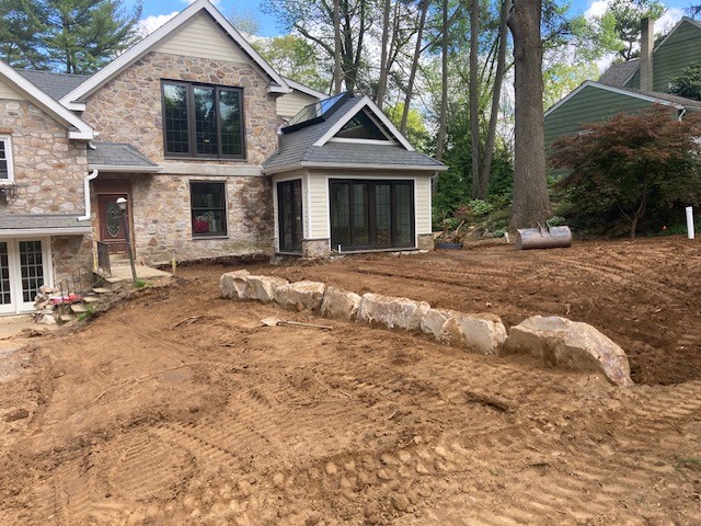 Grading and rock retaining wall service at a Montgomery County residence